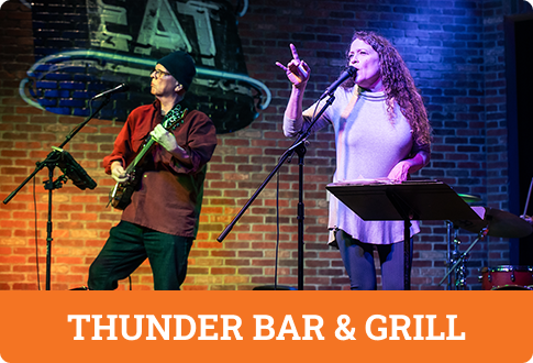 Two musicians performing at Thunder Bar & Grill